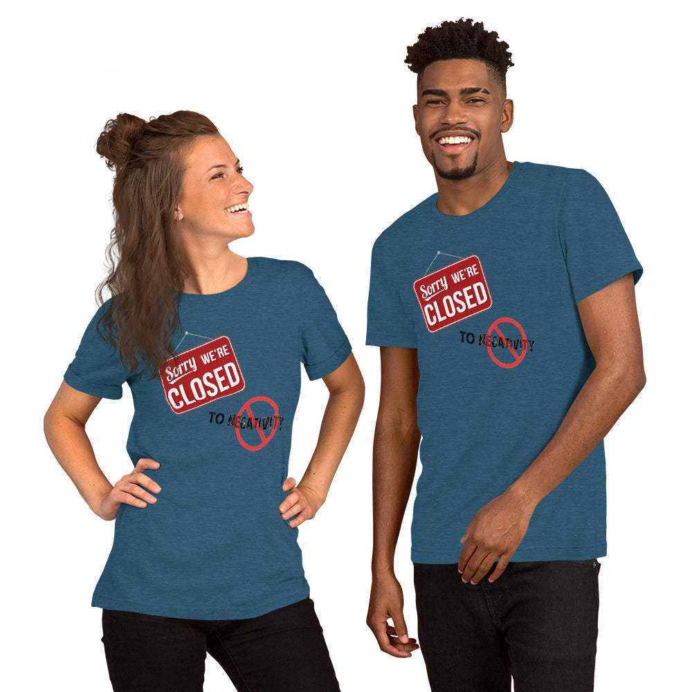 smiling couple with closed to negativity tees